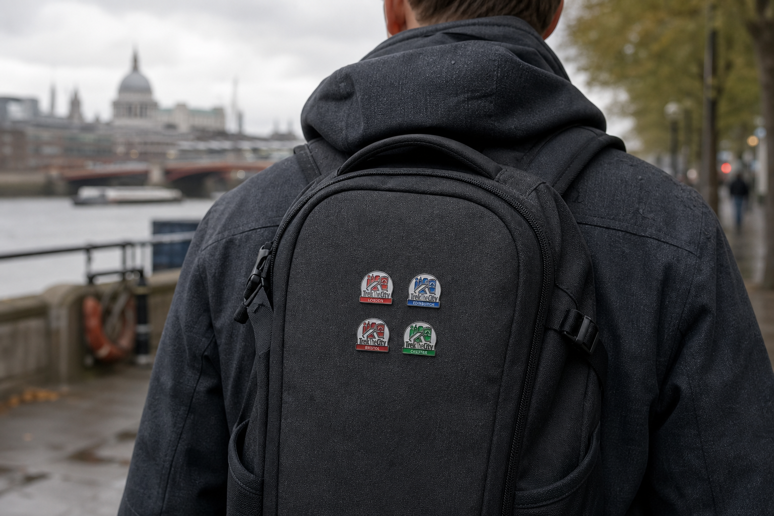 A city walker carrying a backpack decorated with four small Trek the City pins